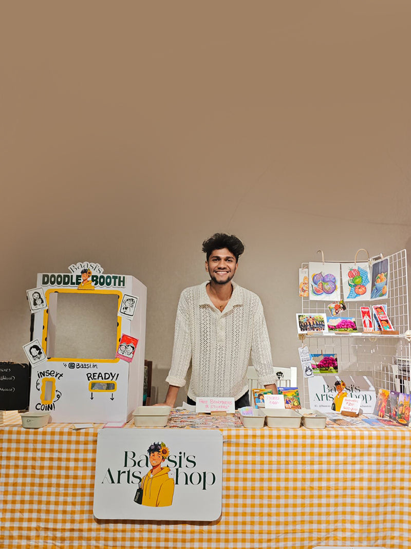 Baasi's live doodle booth set up at an event, with doodle cards pinned on the booth