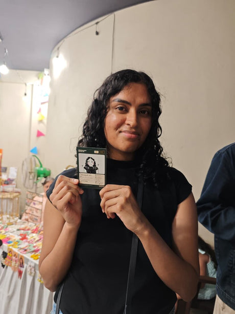 Guest with their live doodle portrait: tiny doodle, big smile