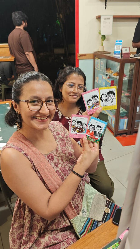 Guest with their live doodle portrait: fresh from the booth
